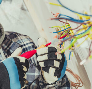 a licensed electrician from Altech Electric working on electrical wiring